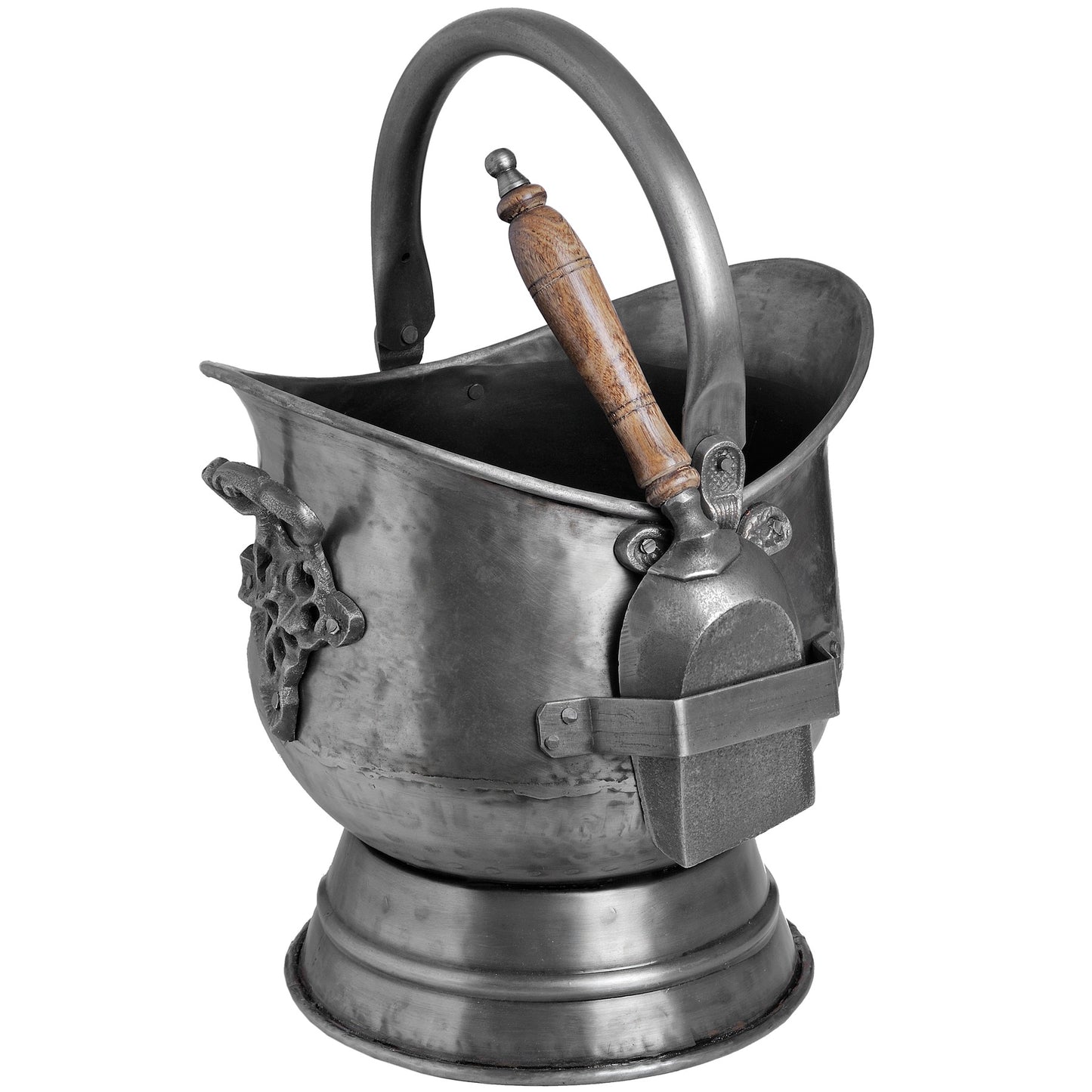 Antique pewter coal bucket with intricate floral embossing, curved handle, and wooden shovel, showcasing a weathered patina.