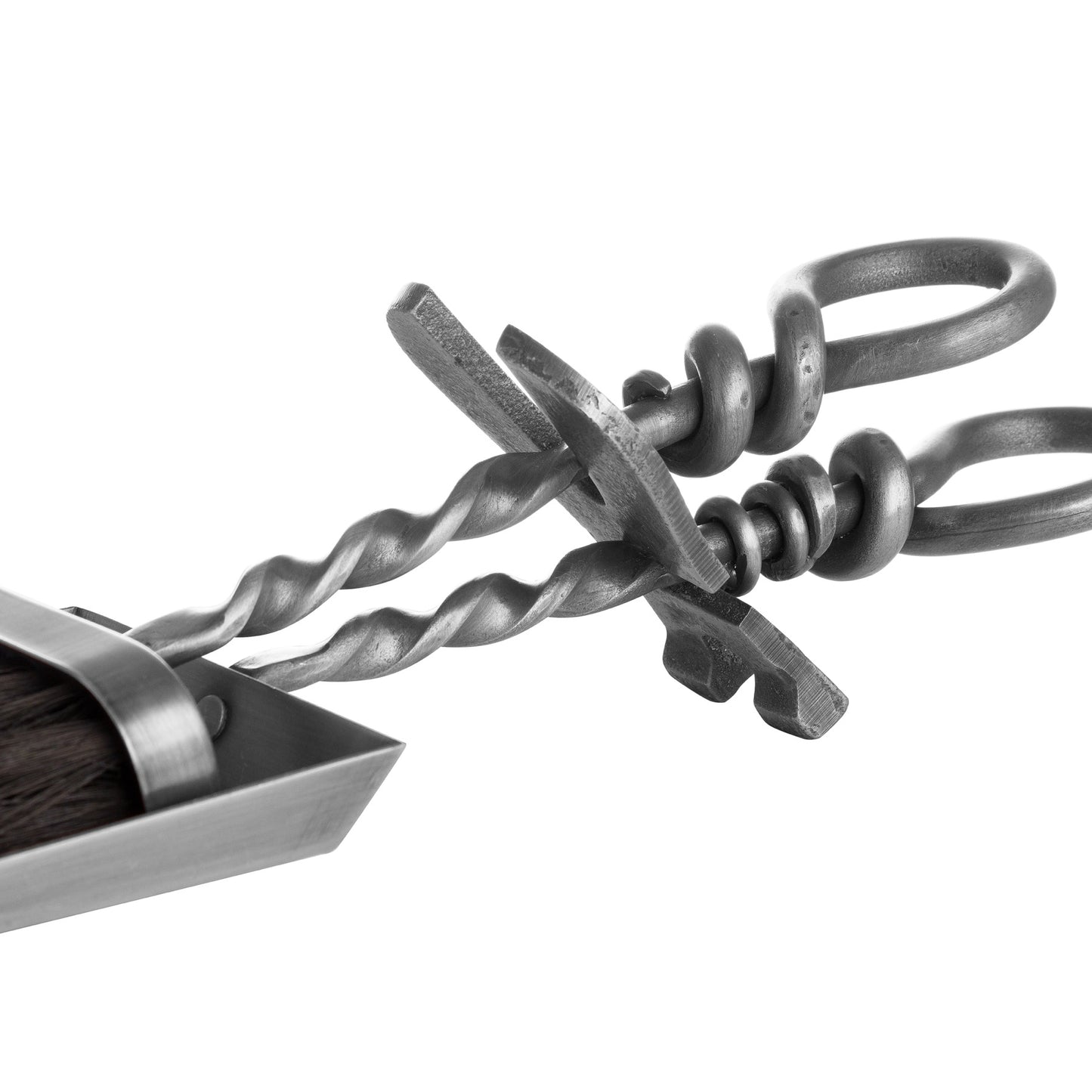 Silver hearth tidy set featuring a hand-turned loop handle, elegantly twisted for comfort, blending functionality with sophistication.