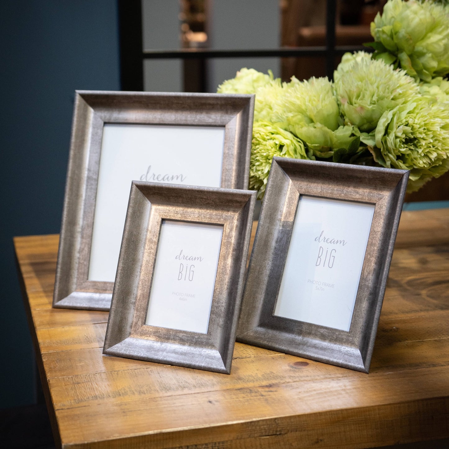 Convex silver photo frame set with distressed finish, showcasing elegant design, ideal for home decor accents.