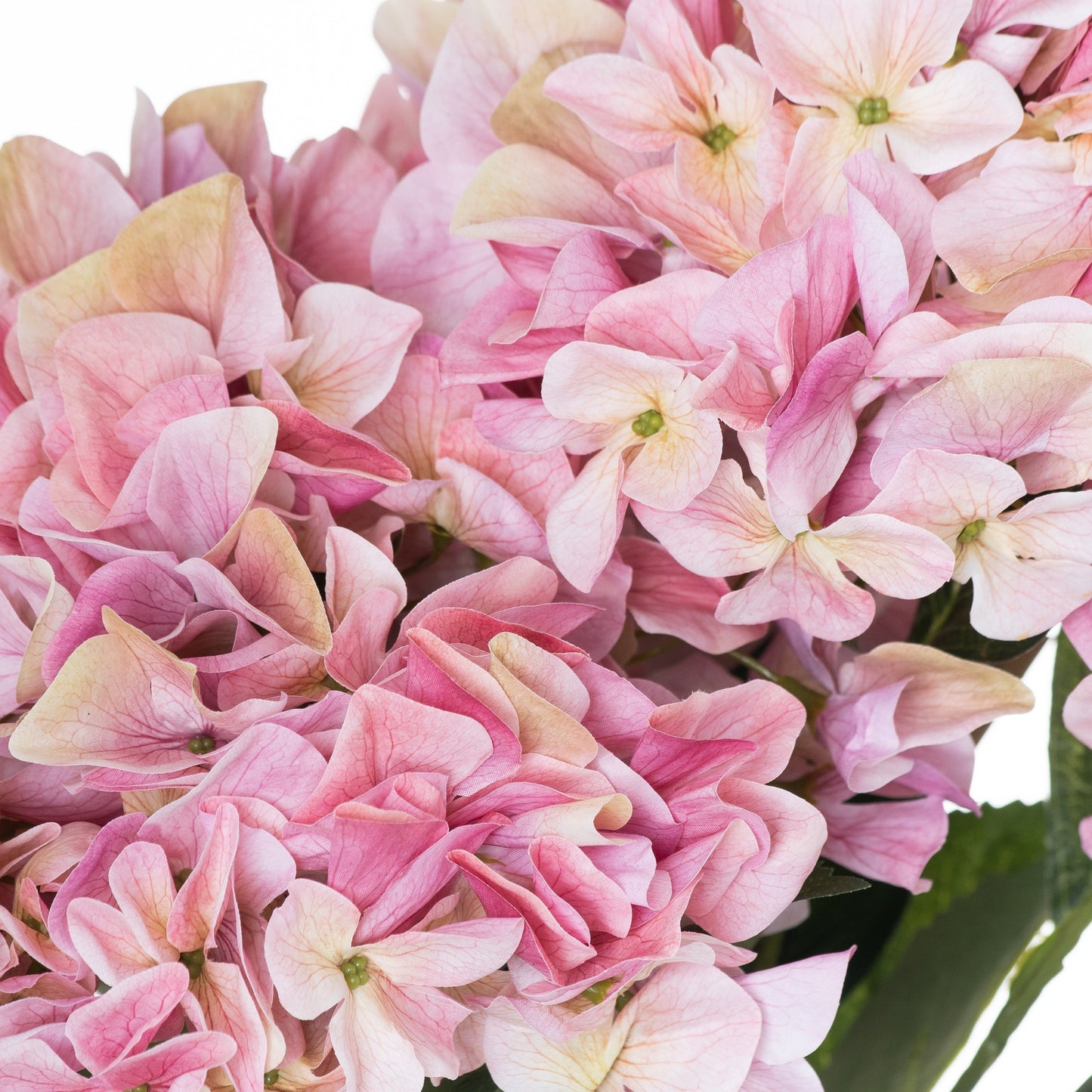 Delicate artificial hydrangeas in soft pink hues with exquisite detailing, perfect for enhancing any decor.