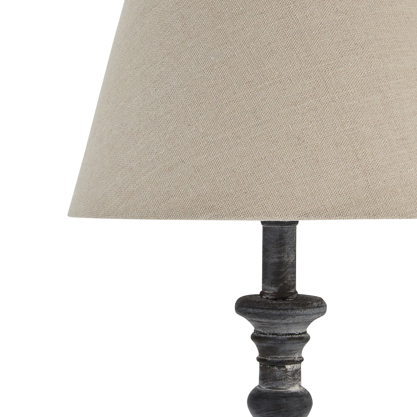 Grey-washed wood table lamp with a soft natural linen shade, exuding timeless elegance and warmth. Ideal for enhancing interiors.