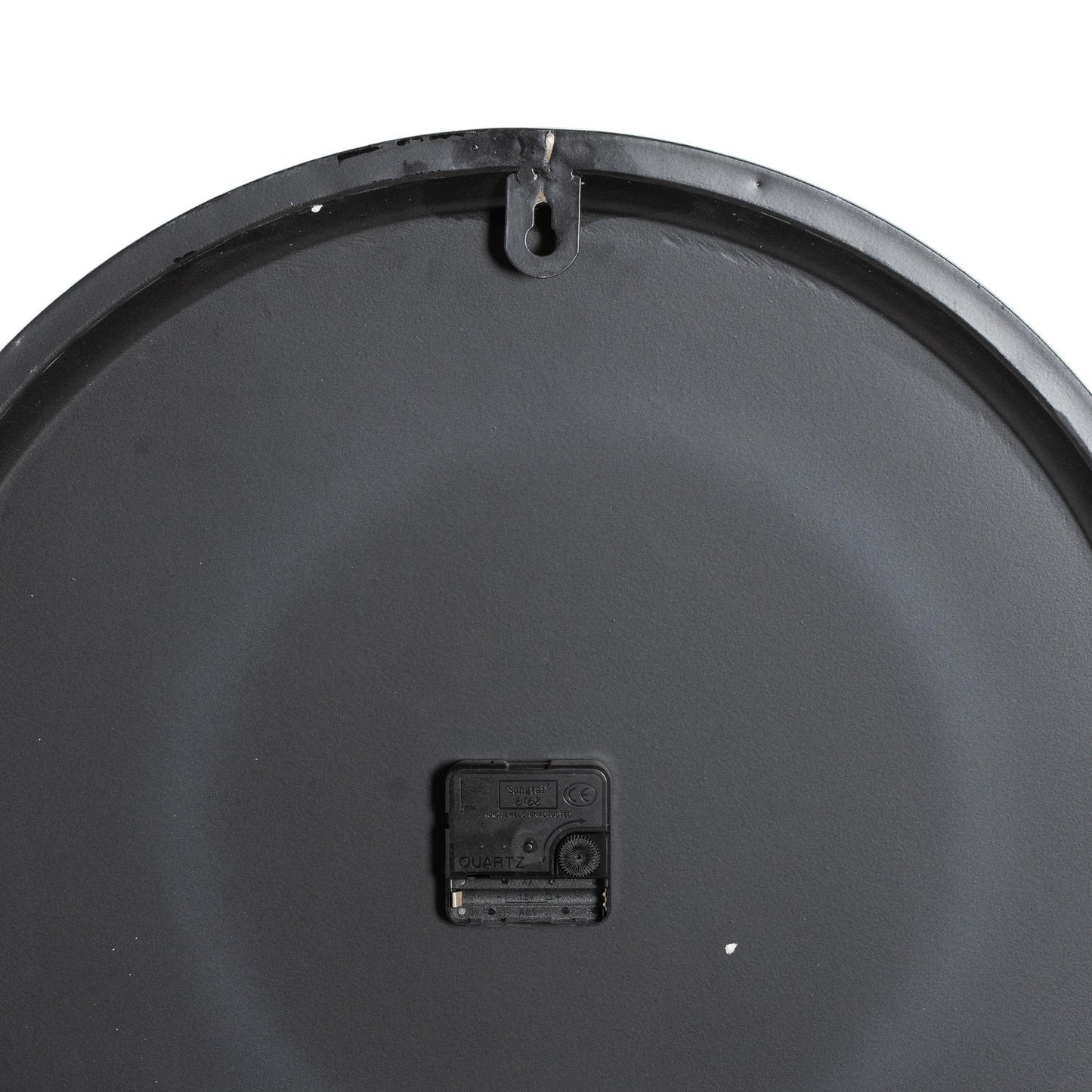 Sleek black wall clock back with quartz mechanism; minimalist design suited for modern interiors, showcasing refined craftsmanship.