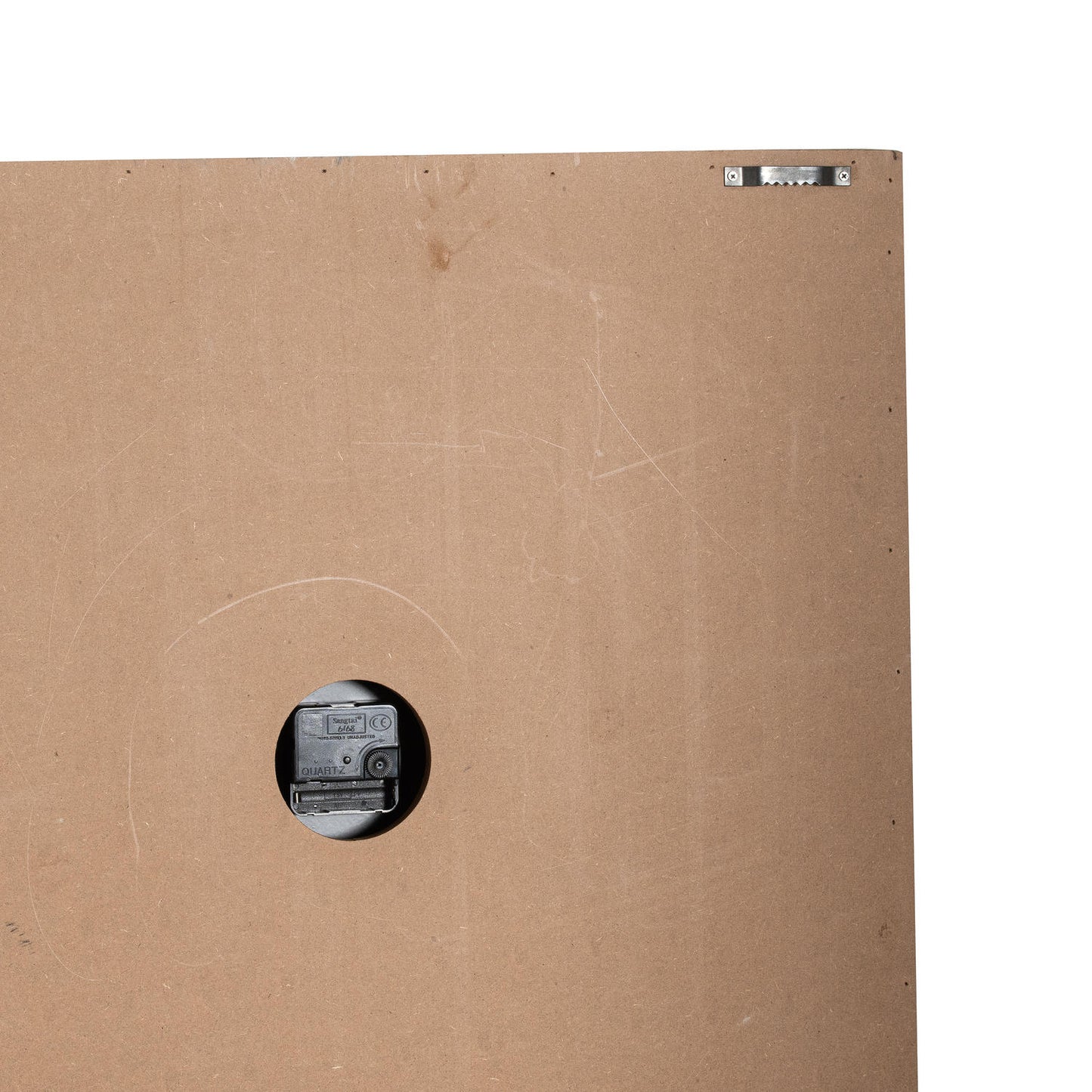 Brown back of a square wooden wall clock with a black clock mechanism visible through a circular cutout, featuring a hanging hook.