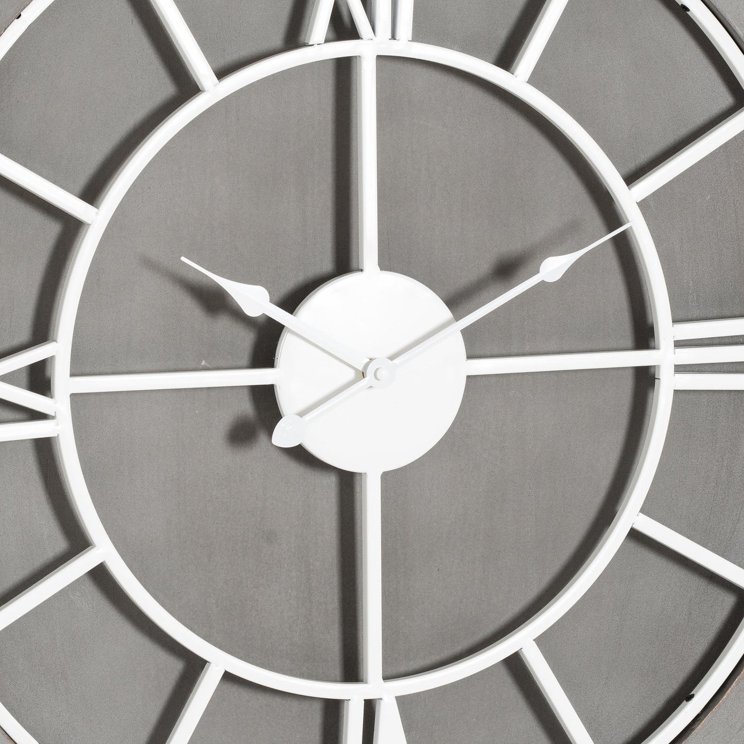 Sleek grey wall clock featuring white Roman numerals and elegant metal hands, perfect for timeless home decor.