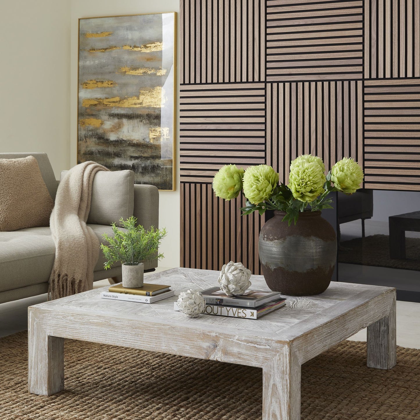 Lifelike green faux rosemary in a neutral stone-effect pot, set against a stylish living room backdrop, adding elegant charm.