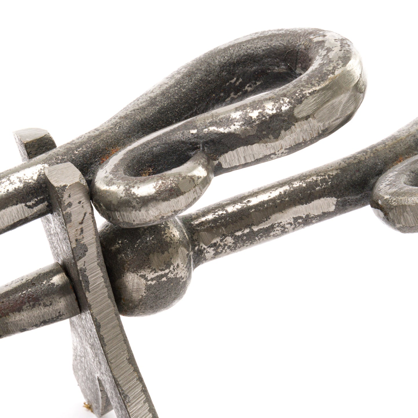 Antique pewter hearth tidy features a sleek, curved crook handle with a shimmering metallic finish, showcasing exquisite craftsmanship.