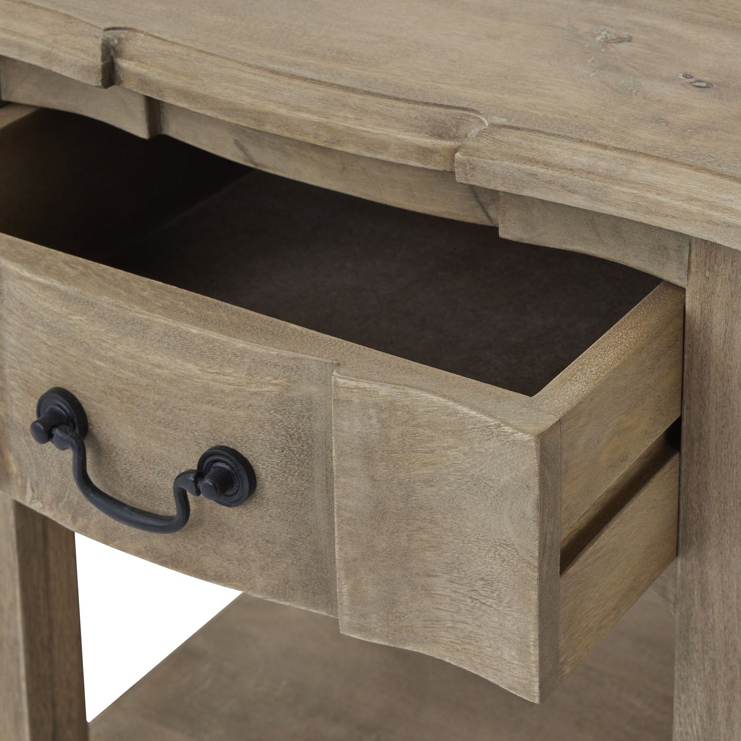 Rustic side table in washed, bleached hardwood with a classic design, featuring a spacious drawer and black iron handle.