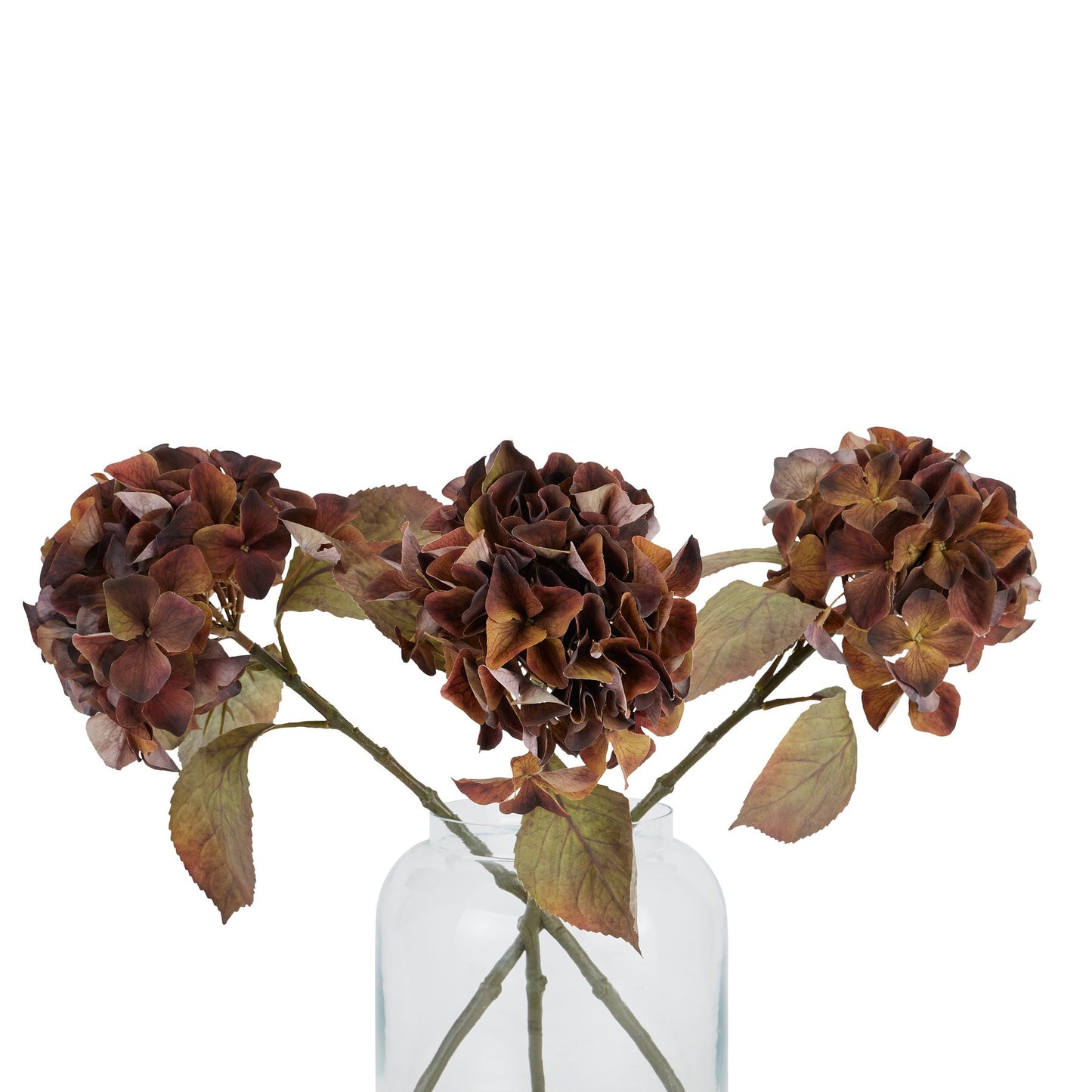 Three large artificial hydrangea blooms in deep brown, amber, and russet hues, complemented by leafy green stems.