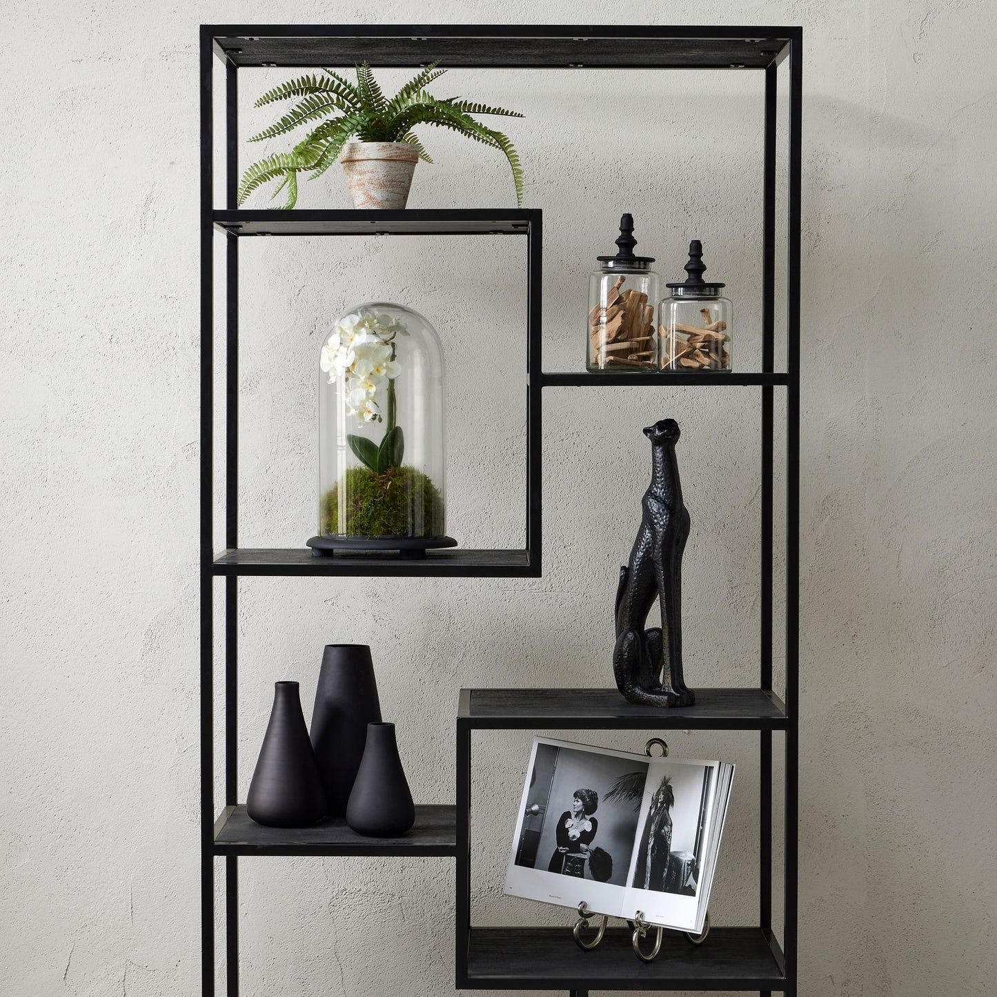Sleek black tapered glass vase with a matte finish, ideal for elegant floral displays or as a standalone accent piece.