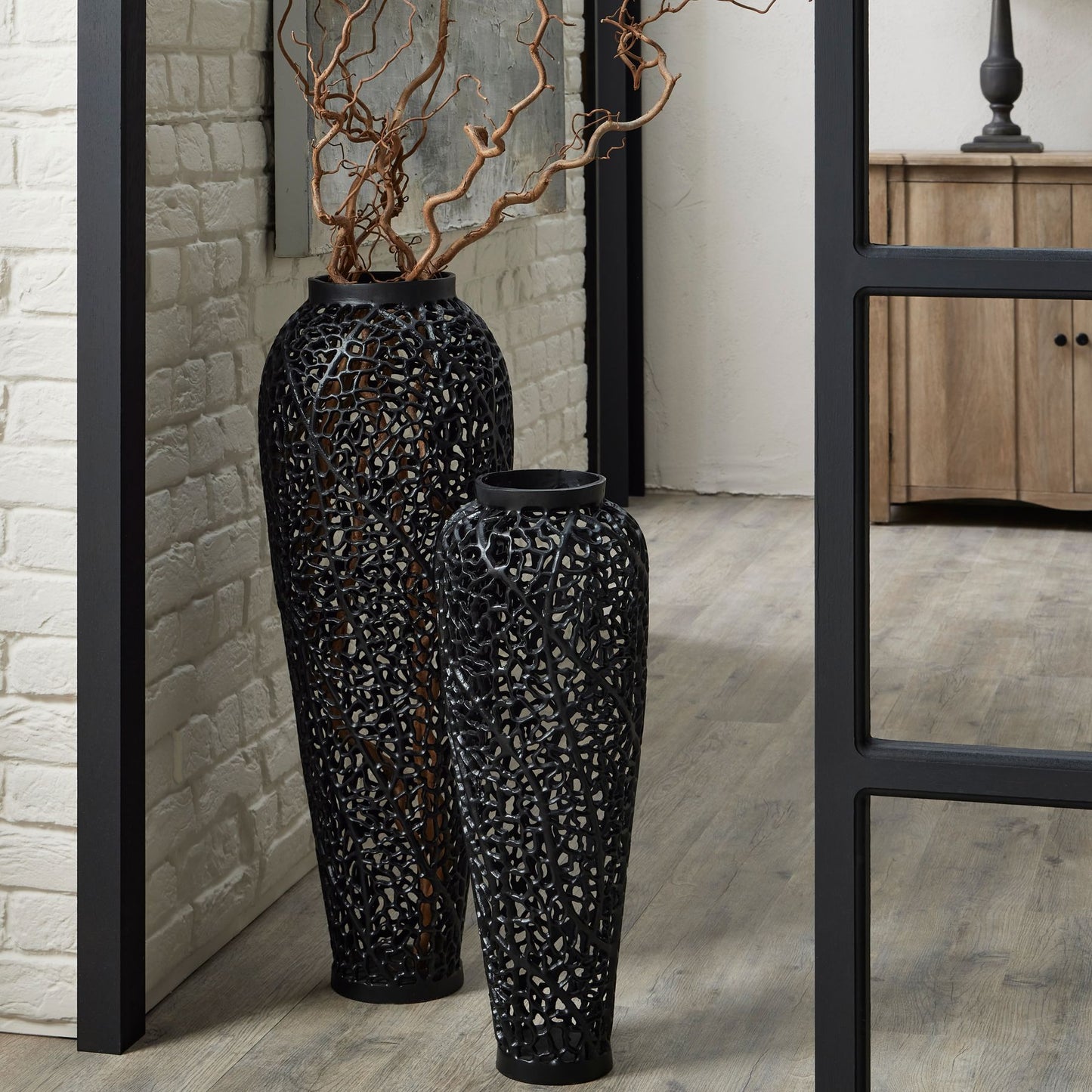 Elegant large black cast vase featuring intricate lattice design for striking visual depth, perfect for modern decor.