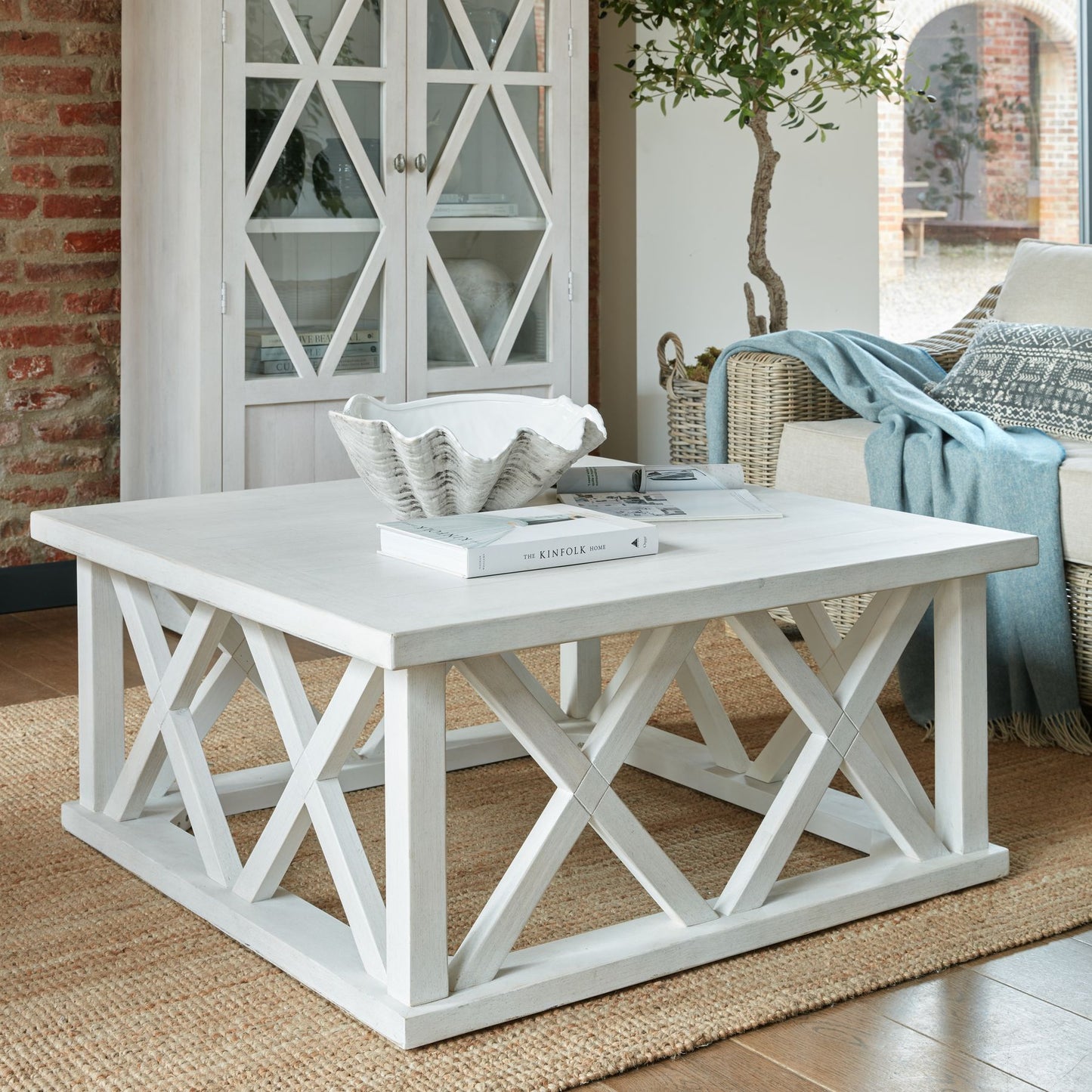Square white coffee table with a unique lattice design, featuring weathered pine and an elegant, rustic charm.