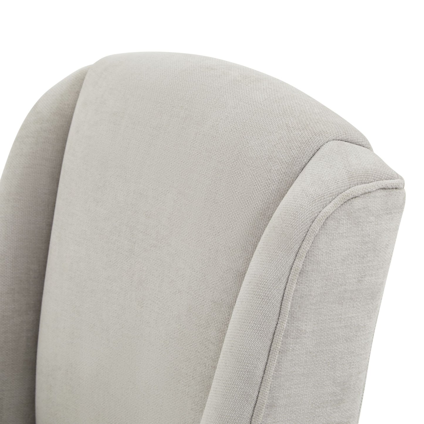 Light grey upholstered dining chair with a softly curved back, showcasing refined craftsmanship and contemporary design.