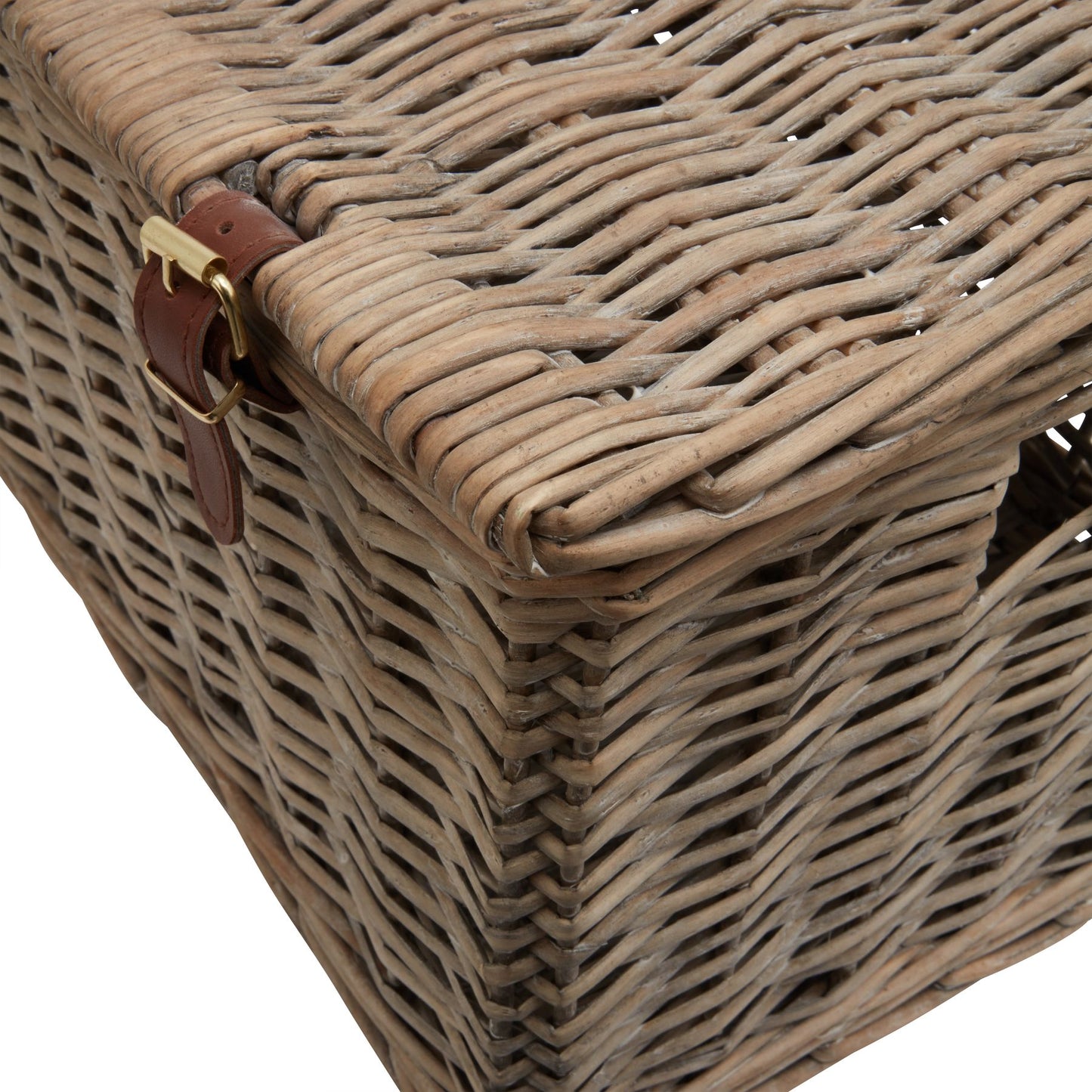 Coastal-inspired wicker hamper basket with intricate weaving, natural tones, and a leather strap, perfect for stylish storage.