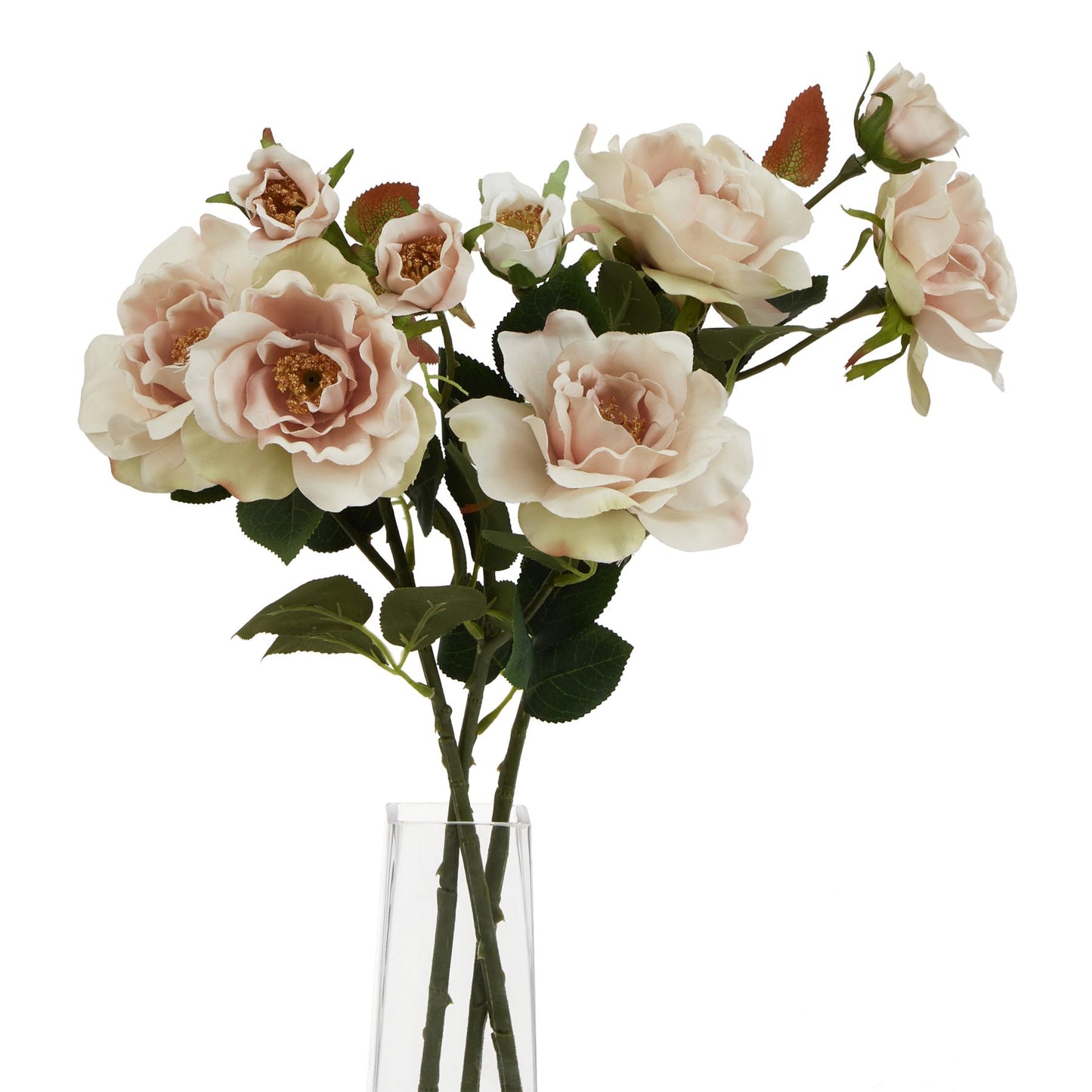 Soft pink artificial tea roses with layered petals and green leaves in a clear vase, adding elegance to any decor.
