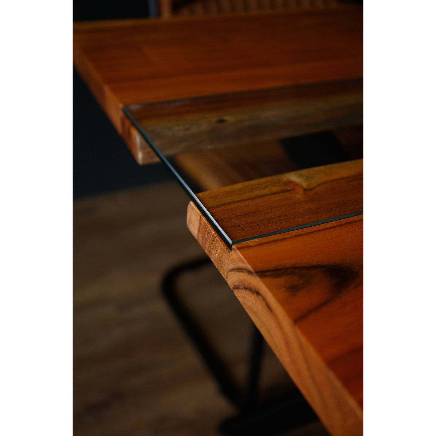 Live Edge Square River Dining Table features rich wood tones and a glass inlay, supported by a sleek black metal base.