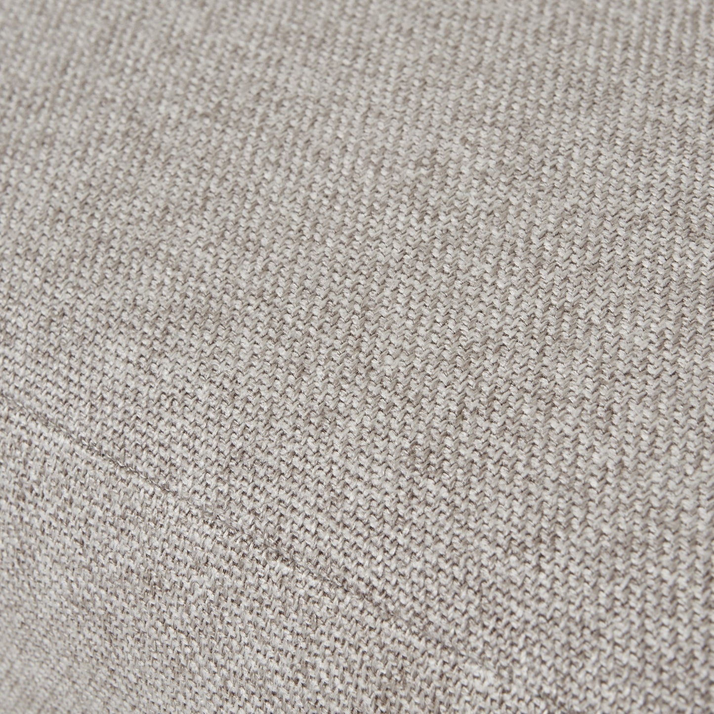 Plush oatmeal-twill upholstery with intricate tufting on a dining chair, featuring solid oak legs for durability and elegance.