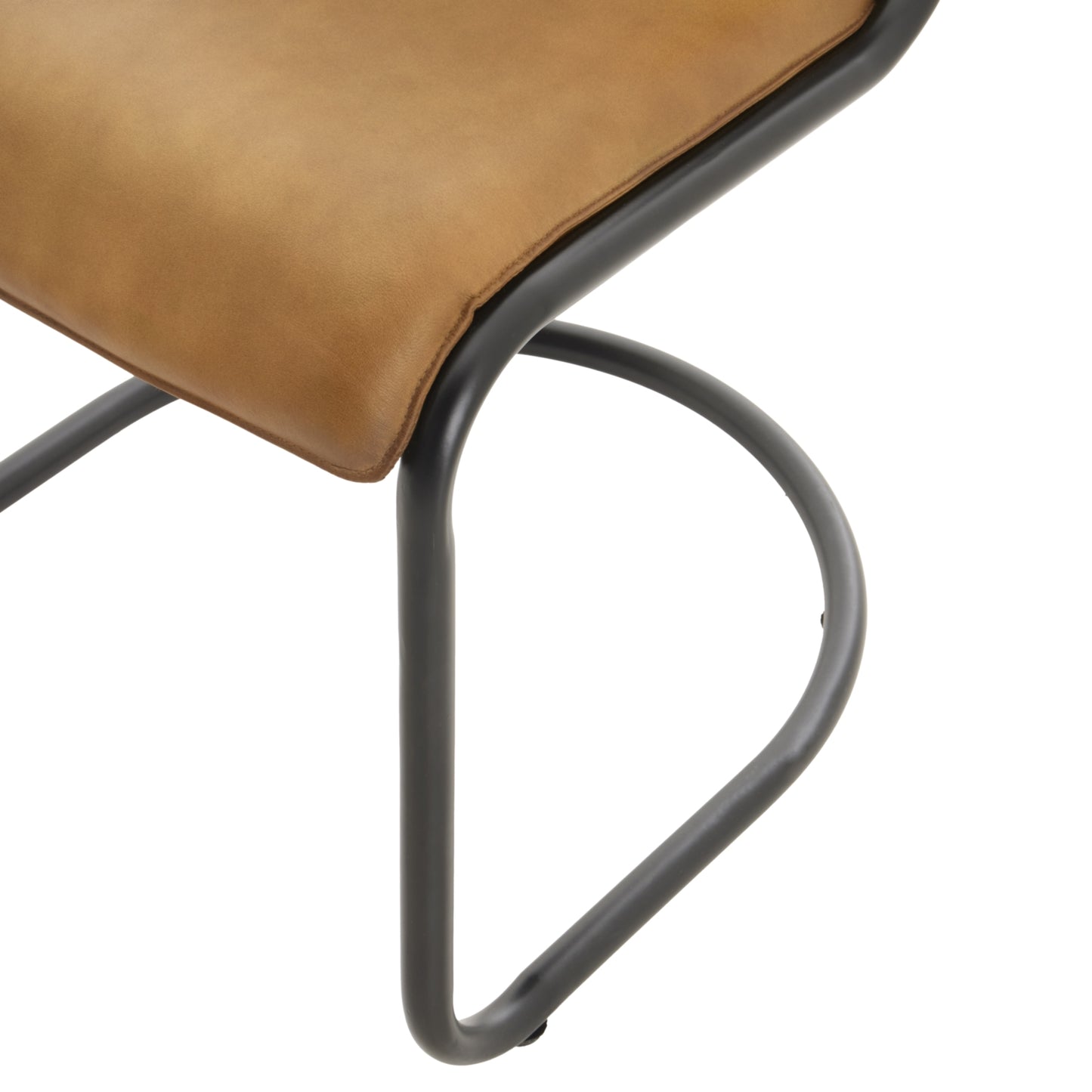 Curved dining chair featuring a buttery-soft tan leather seat and a sturdy black metal frame, exuding modern elegance.
