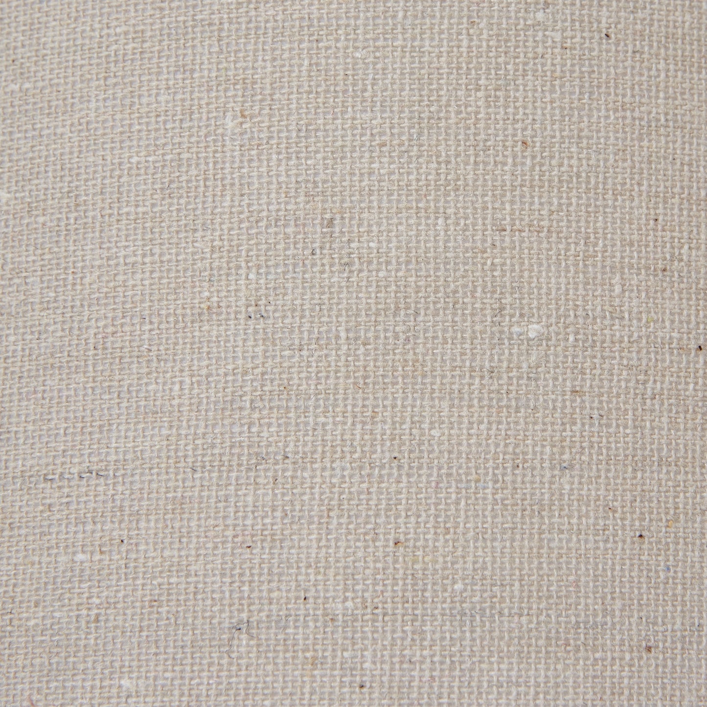 Linen shade in a neutral tone atop a distressed black base, combining rustic charm with versatile elegance for any decor style.