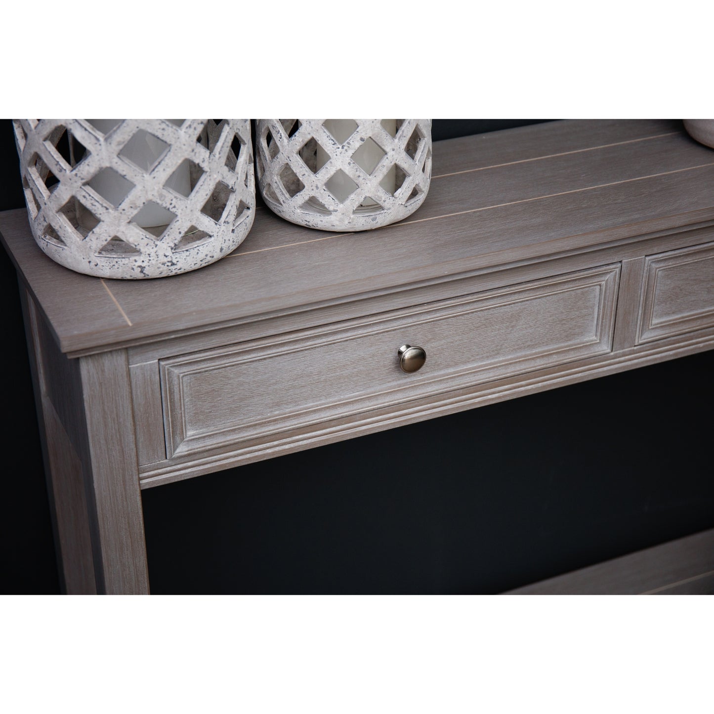 Light gray two-drawer console table with elegant detailing, featuring a brushed silver drawer knob, complemented by decorative vases.