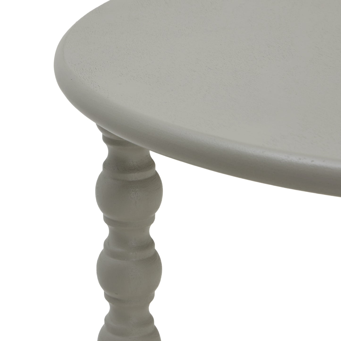 Round side table with a smooth, light gray surface and elegantly detailed turned legs, blending modern style with functional design.