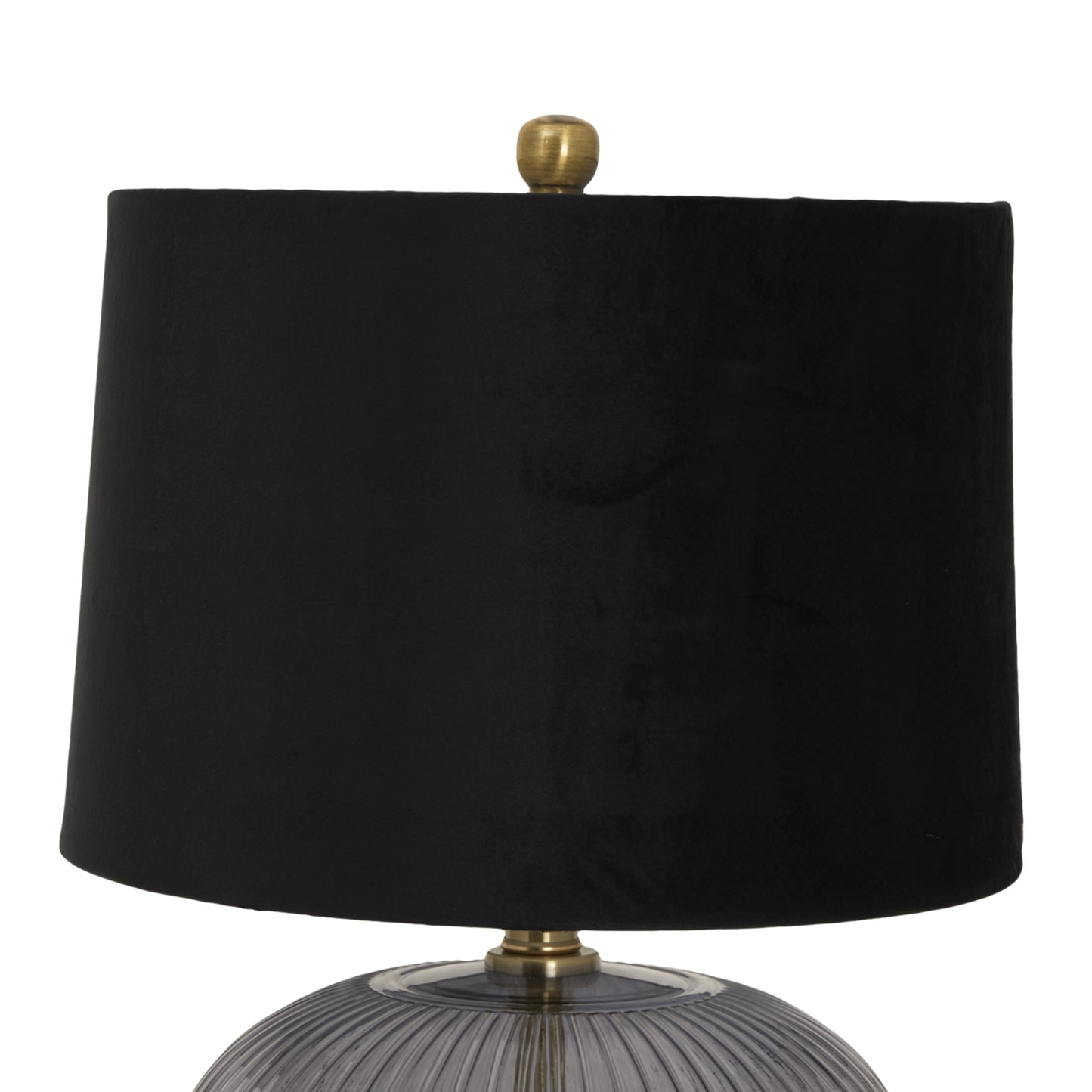 Ribbed glass lamp base with a black velvet shade and a gold finial, offering a modern, elegant touch to any space.
