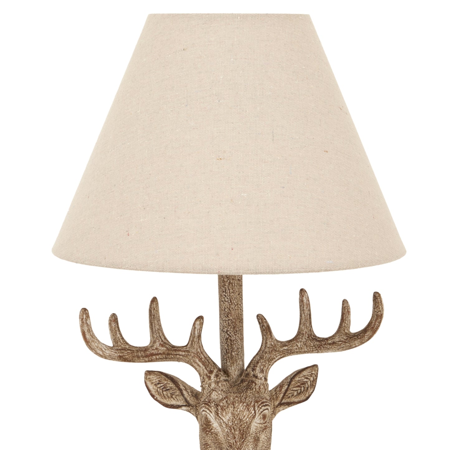 Stonewashed stag head table lamp features a rustic design with a textured finish and a contemporary linen shade in beige.