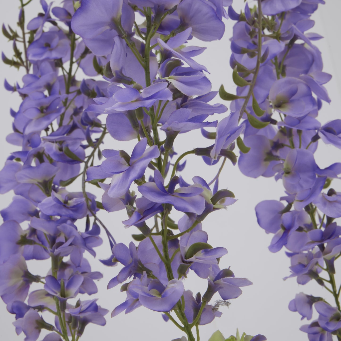 Large purple wisteria spray with cascading blooms and green accents, measuring 180cm, for elegant floral arrangements.
