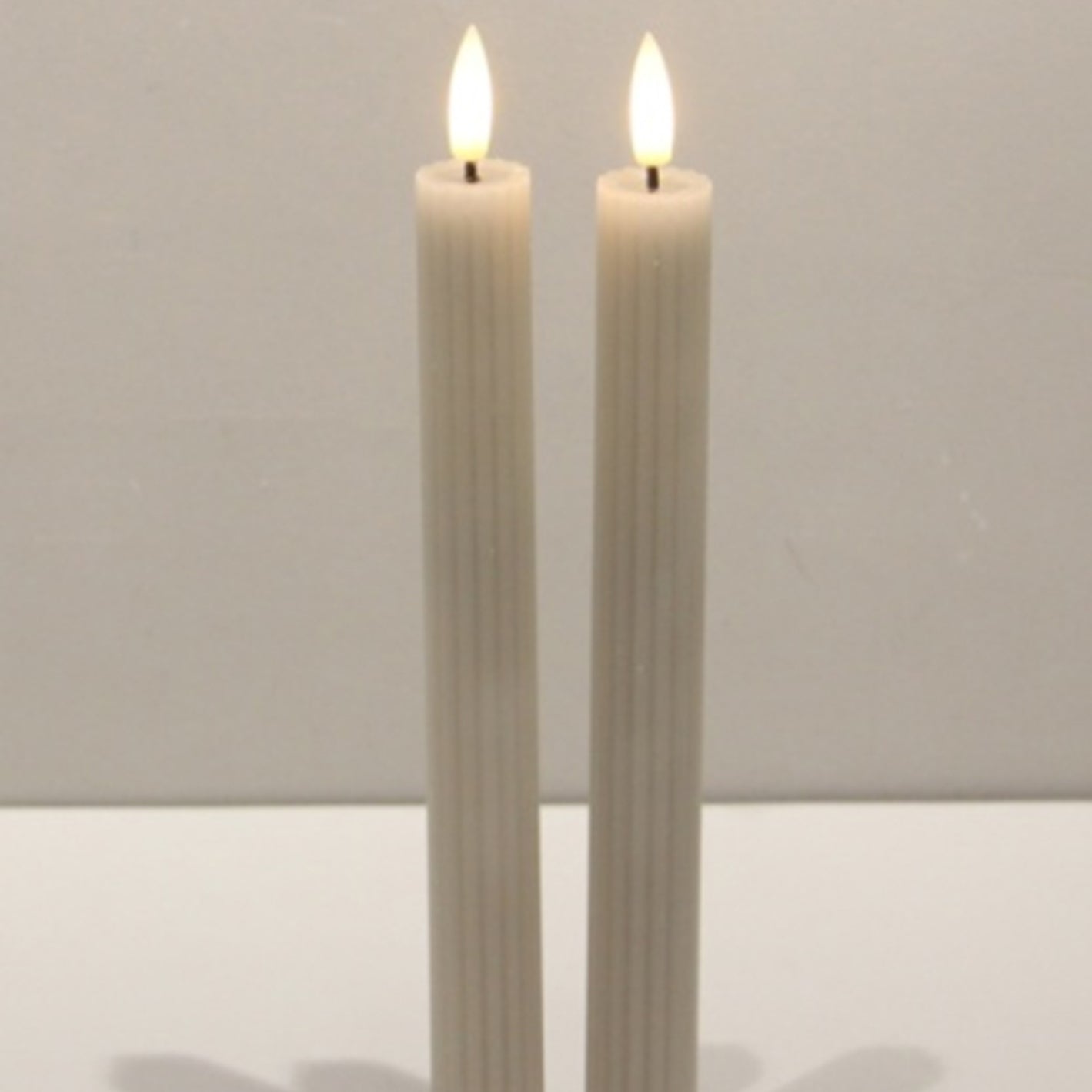 Luxe Collection Natural Glow Taupe Ribbed Taper Candles - Candles from the Quanta Home collection.