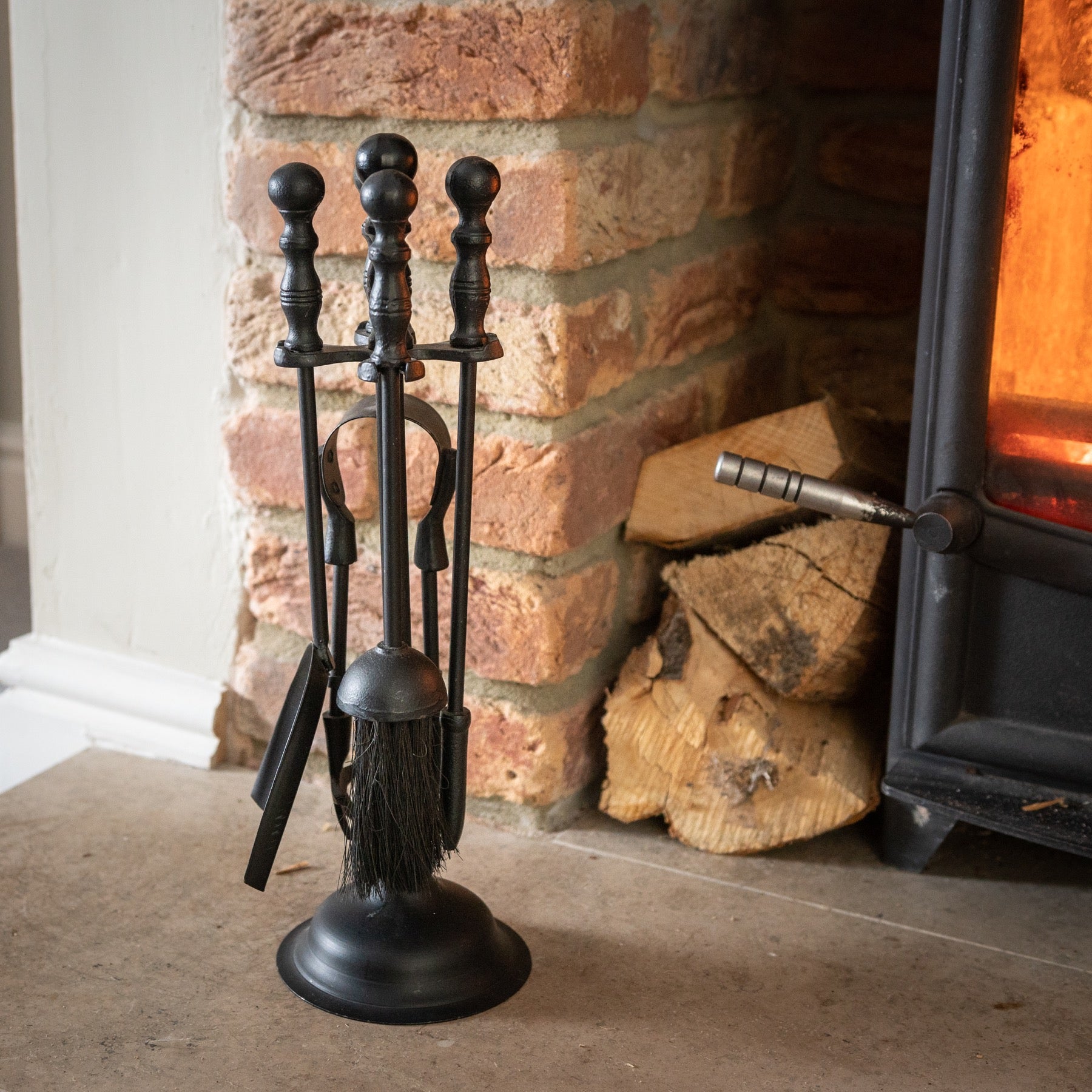 Elegant black fireside companion set featuring ornate Duchess top and durable polished finish, perfect for any decor.