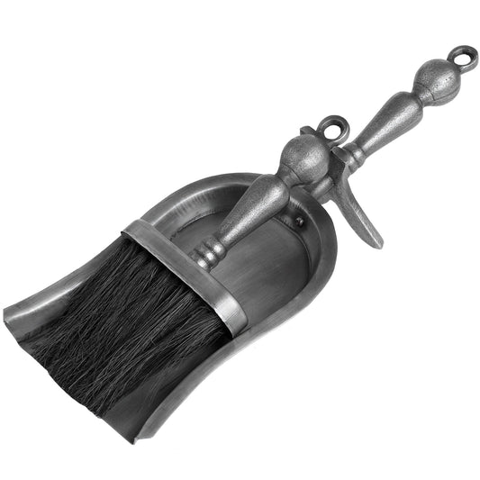 Antique pewter-finish hand brush and shovel set, featuring elegant design for fireplace maintenance, showcasing refined luxury.