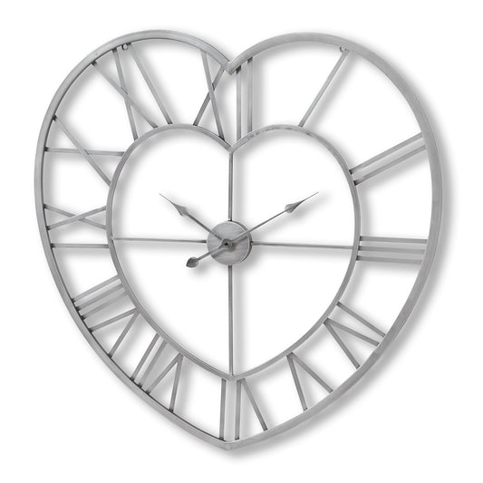 Large silver heart-shaped wall clock featuring Roman numeral dials and elegant hands, offering timeless design and sophistication.