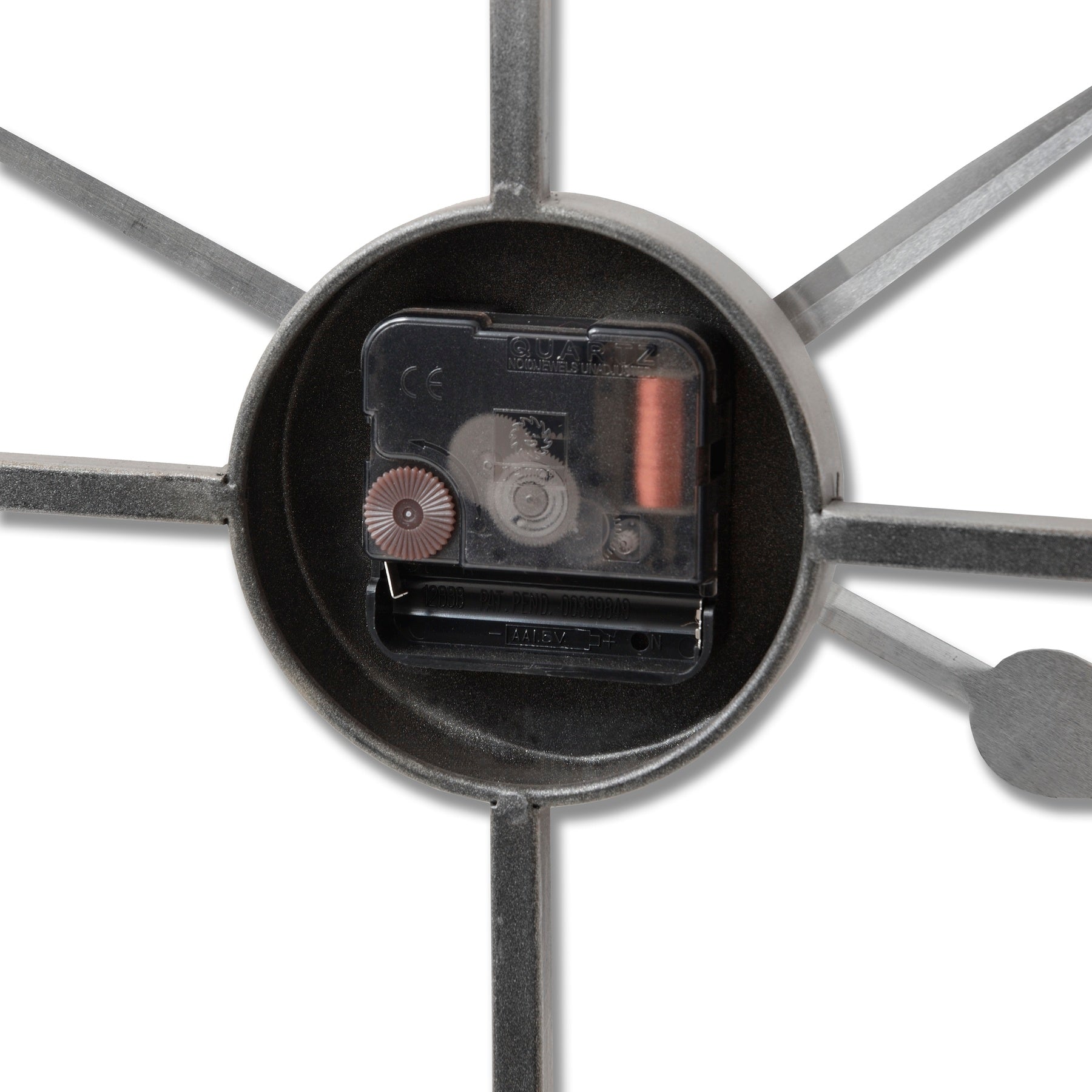Silver skeleton wall clock showcasing intricate gears and a minimalist design, perfect for modern and industrial decor.