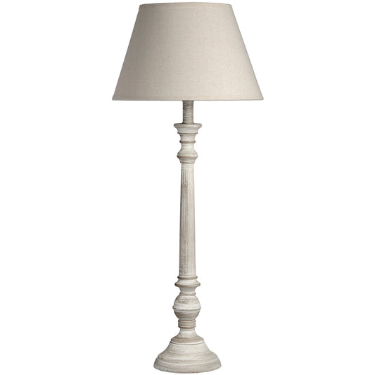 Rustic table lamp with a grey-washed wooden base and a light linen shade, providing soft, inviting illumination.