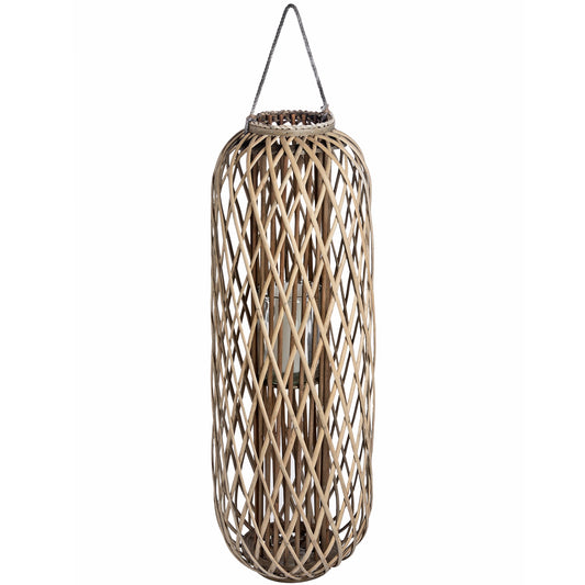 Tall, woven rattan lantern with a natural finish, creating beautiful shadows; includes a hanging loop for versatile placement.