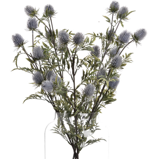 Lifelike blue thistle with powder-blue petals and green foliage, elegantly arranged in a clear vase, ready for coastal or rustic decor.