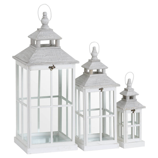 Set of 3 elegant white lanterns in varied heights, featuring a window-inspired design and intricate detailing, perfect for cozy decor.