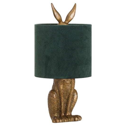 Antique gold hare table lamp with a green velvet shade, combining whimsical charm and elegant design for stylish interiors.
