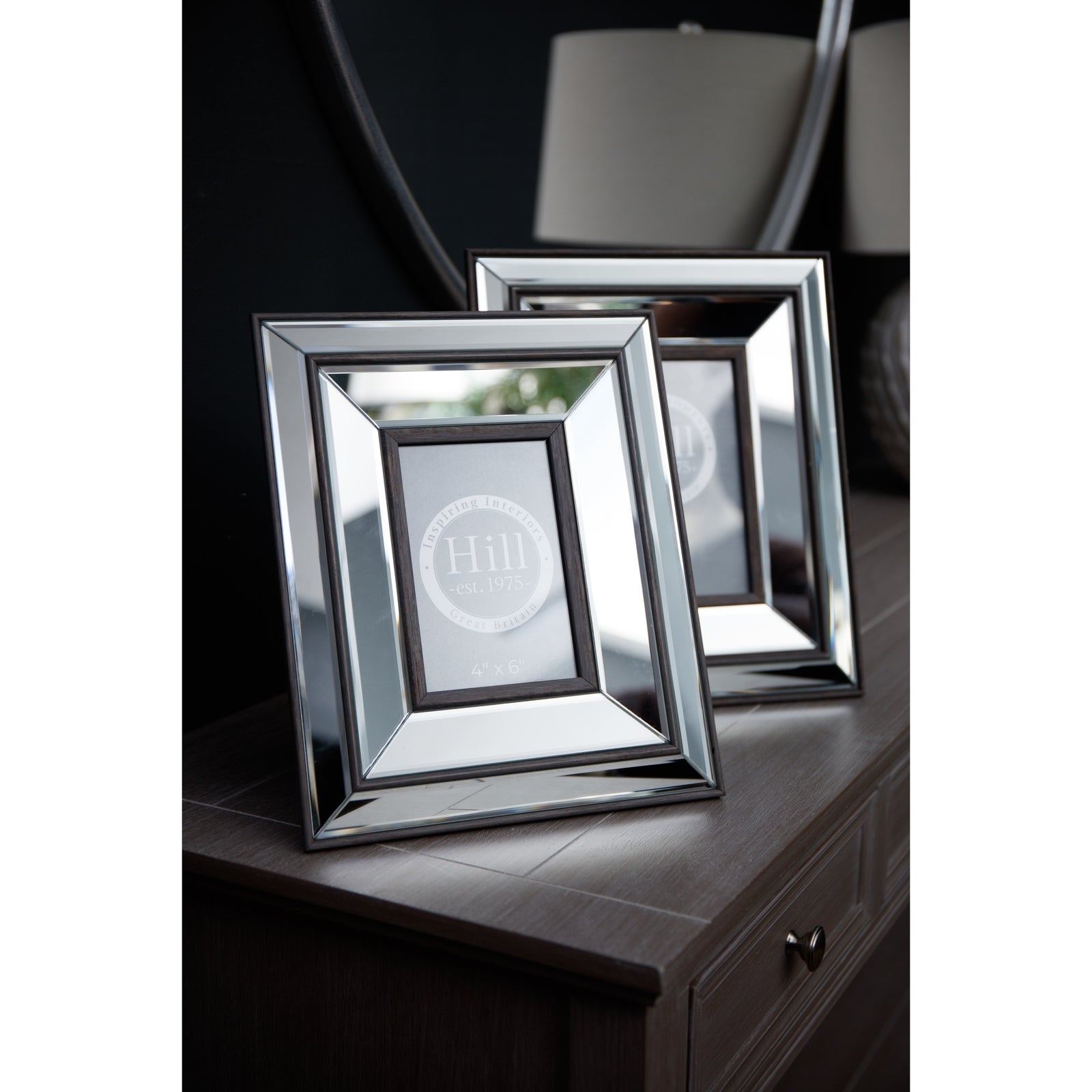 Elegant 5x7 frame with beveled mirrored glass and warm wood tones, showcasing refined sophistication for any decor.