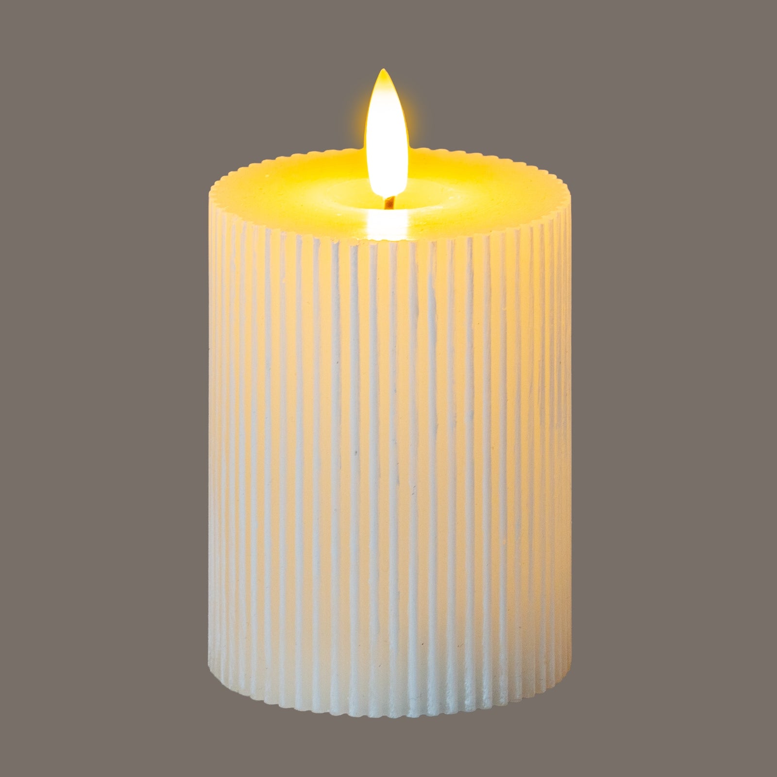 Luxe Collection Natural Glow 3x4 Textured Ribbed LED Candle - Candles from the Quanta Home collection.