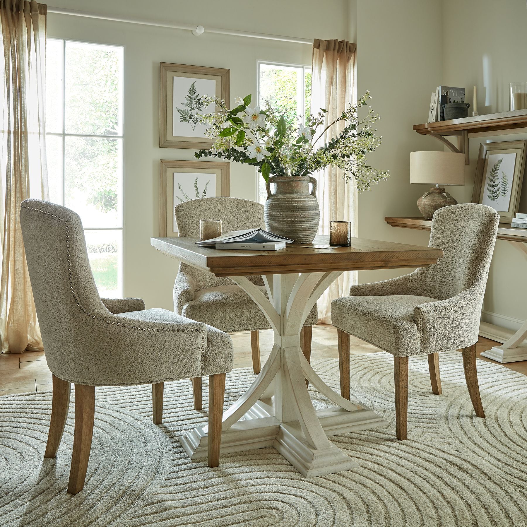 Delicate white Gypsophila spray enhances minimalist decor, featuring refined botanical details in a stylish living space setting.