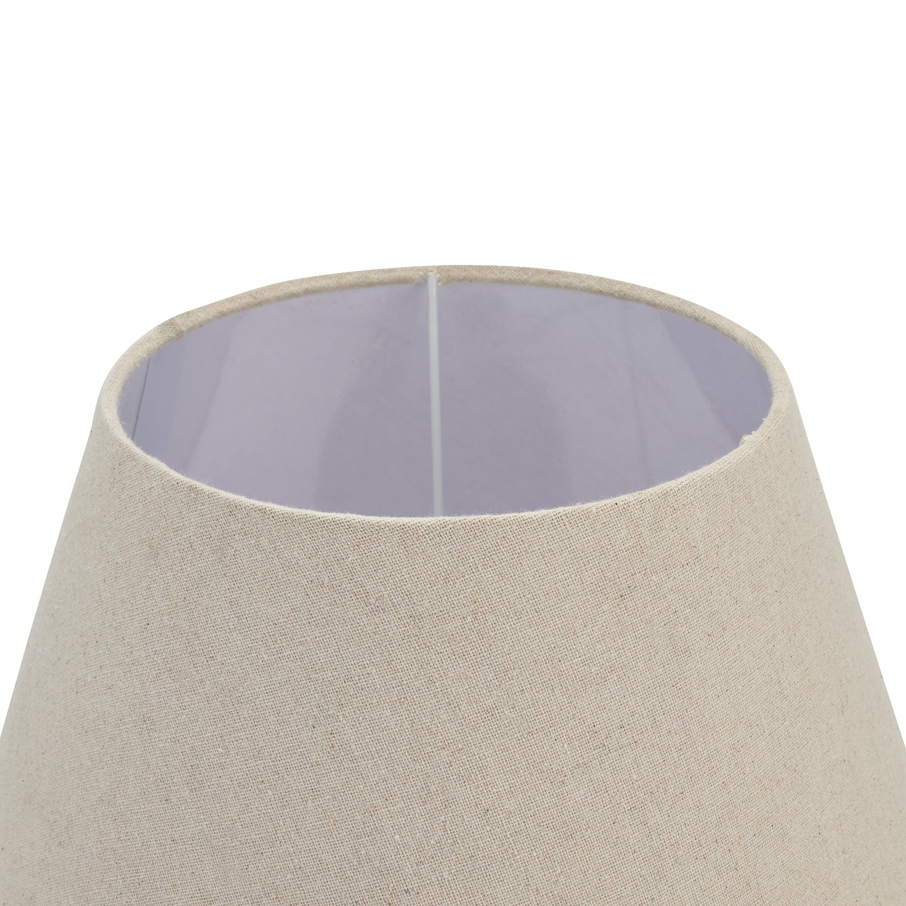 Neutral linen shade atop a grey-washed wood base, creating a warm, inviting glow for elegant interiors.