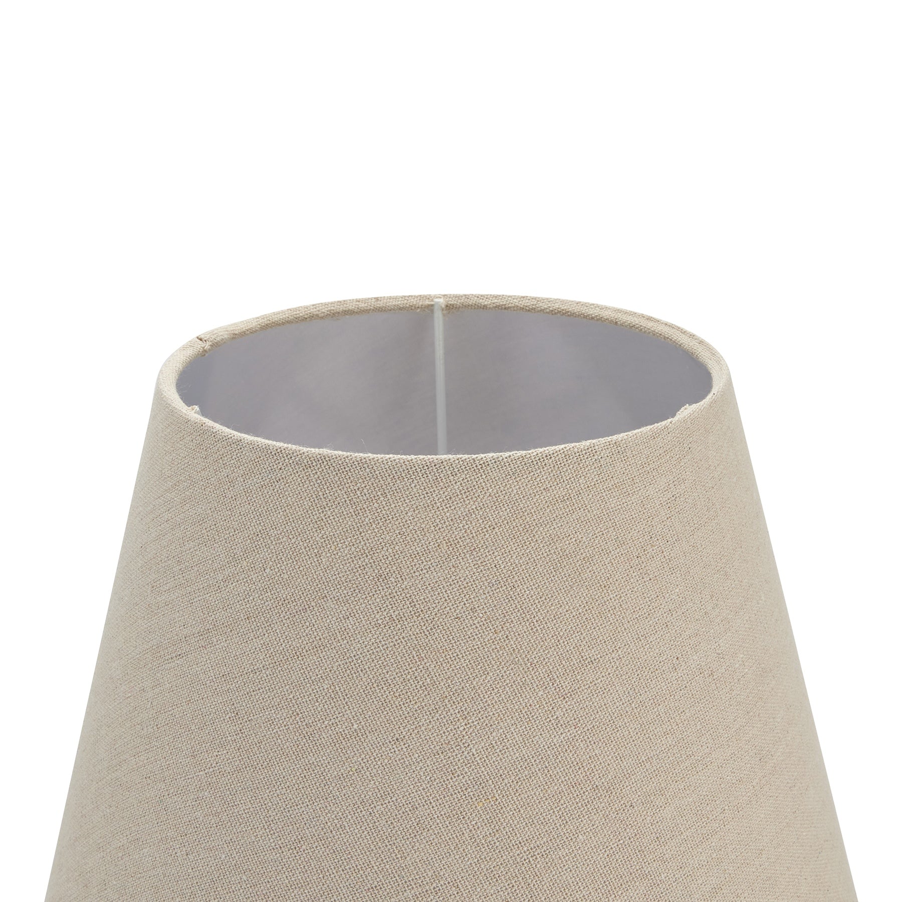 Natural linen shade with a soft, inviting glow atop grey-washed wood, combining elegance and versatility in design.