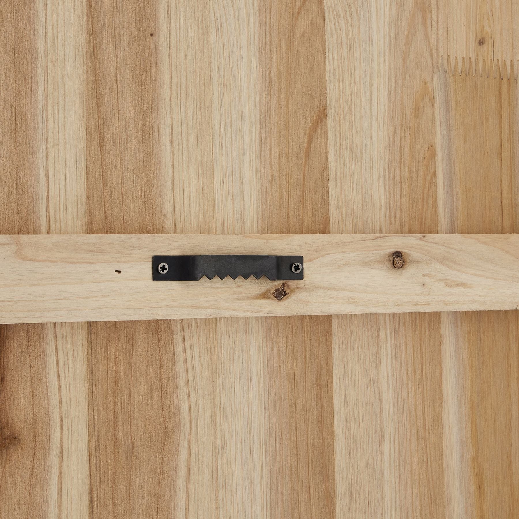 Natural wood backing with a black metal hanger; designed for wall mounting. Crafted for durability and elegance.