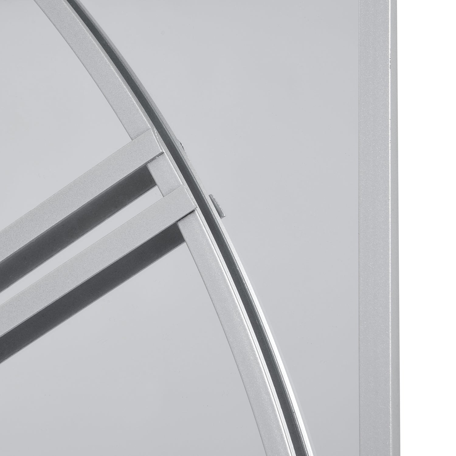 Stylish mirrored wall clock featuring a unique three-panel design with sleek metalwork, reflecting light for a spacious feel.