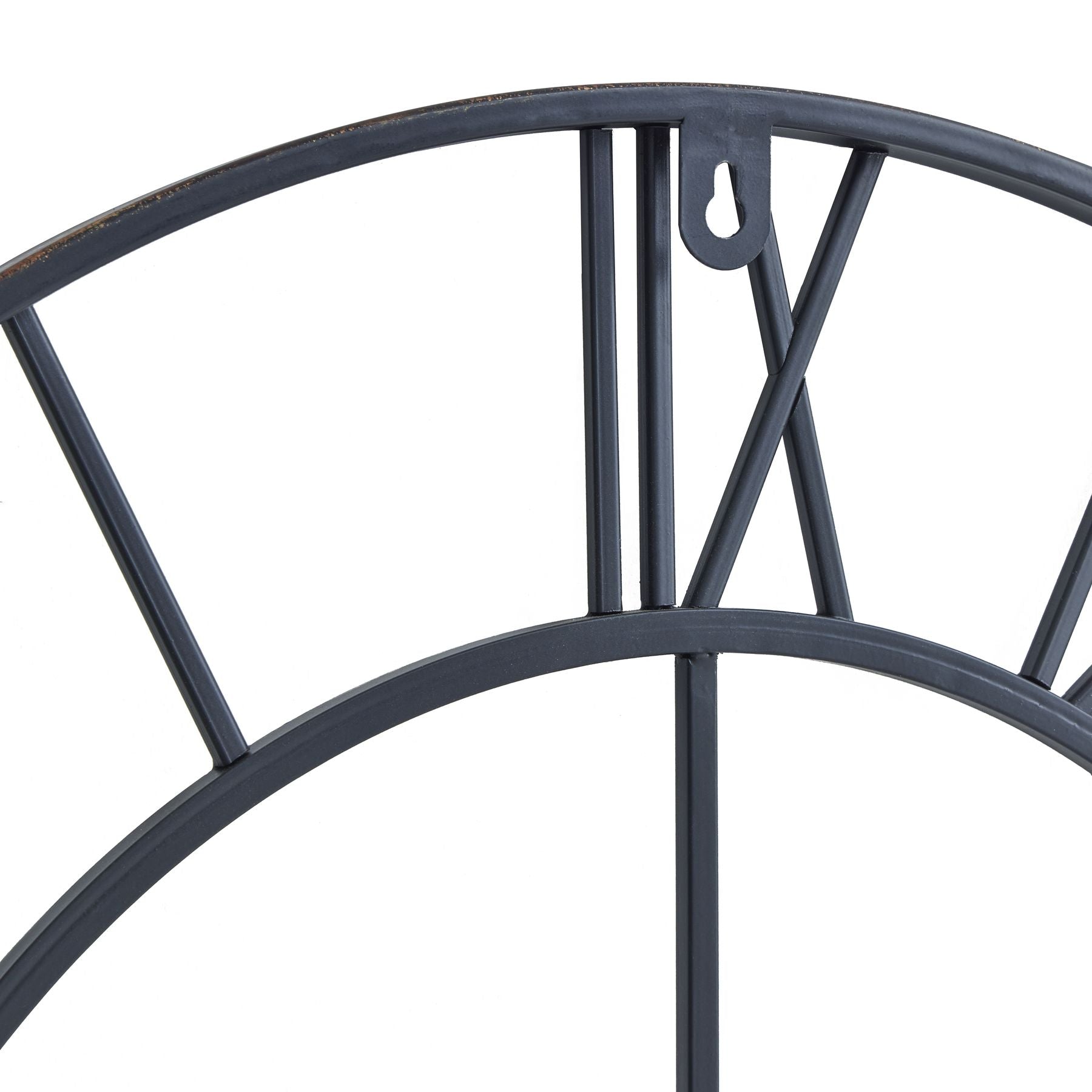 Antique bronze wall clock with open skeleton design, featuring slender Roman numerals, enhancing any interior space.