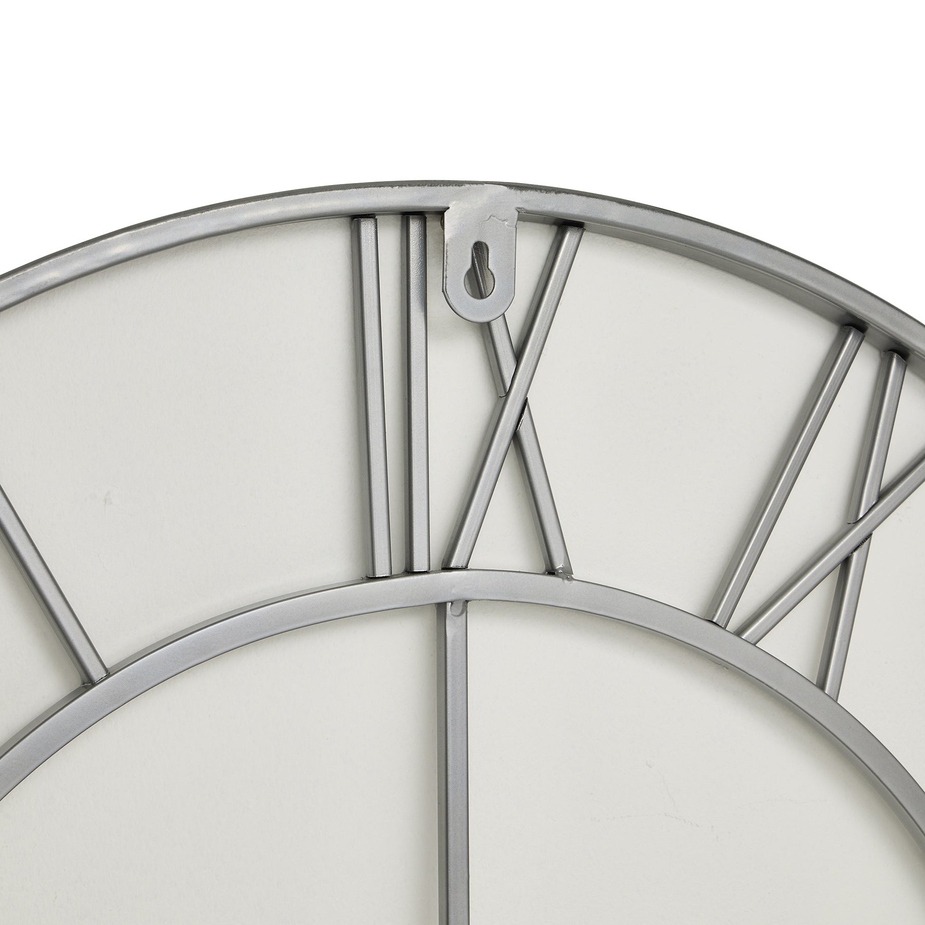 Silver wall clock featuring a unique skeleton design with an open-frame construction, showcasing a sleek finish for modern elegance.