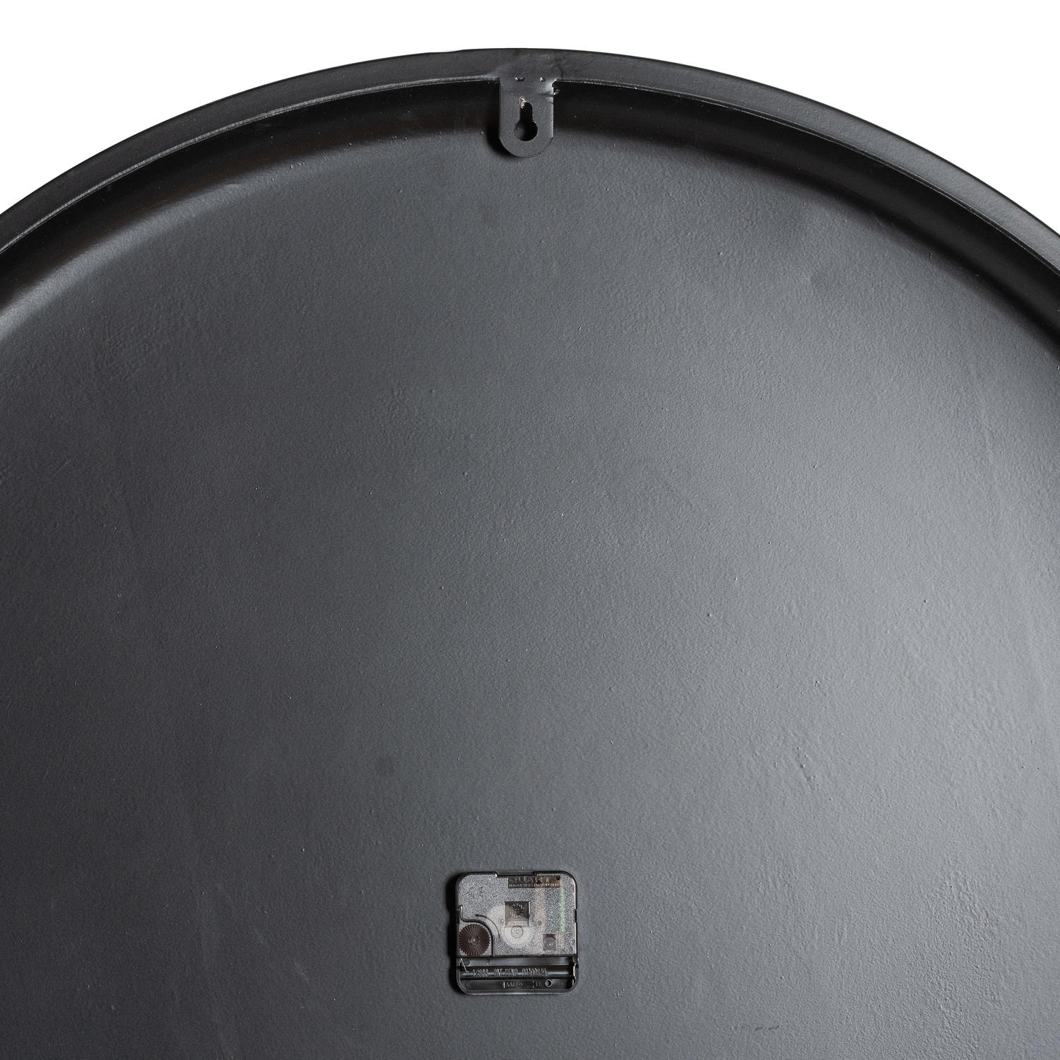 Black back of the Rothay Large Wall Clock, featuring a battery compartment and hanging hook, showcasing a smooth surface design.