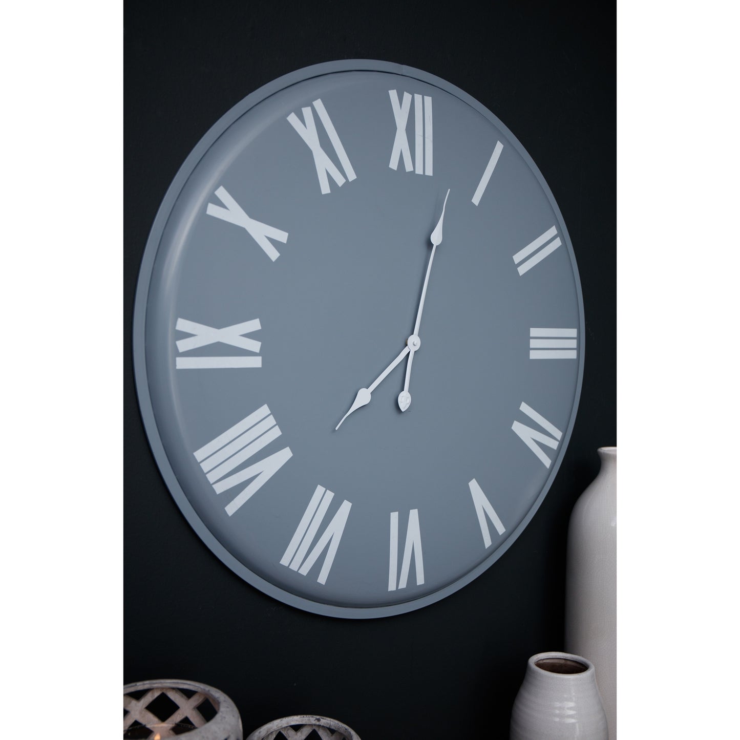 Sleek grey wall clock featuring bold white Roman numerals and hands, measuring 49cm in diameter, perfect for modern interiors.