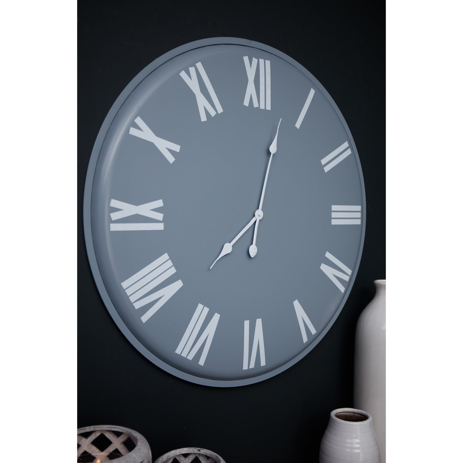 Sleek grey wall clock featuring bold white Roman numerals and hands, measuring 49cm in diameter, perfect for modern interiors.