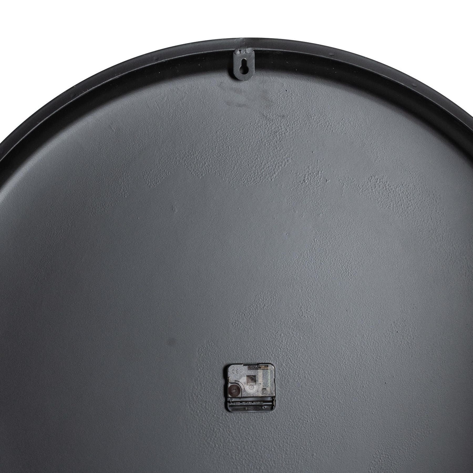 Sleek black back of a large wall clock with a mounting hook; designed for contemporary elegance and minimalist decor.